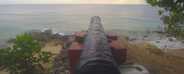 Cannon guarding Speightstown as dusk falls